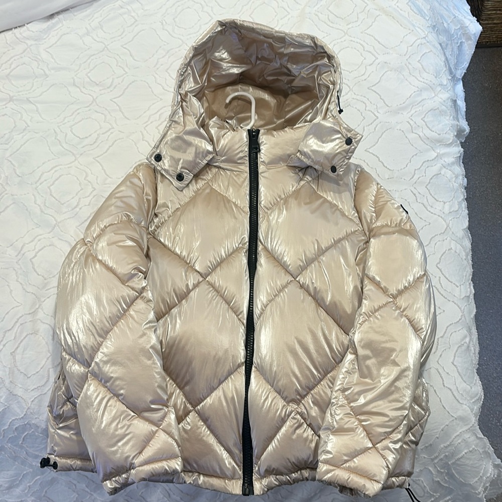 Pink silver jacket. New without ticket. The hood can be removed